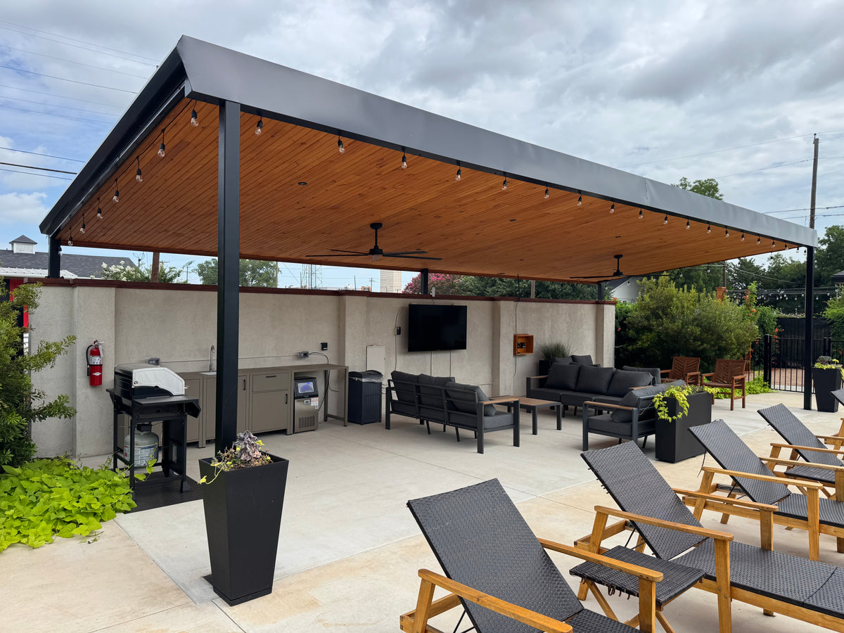 Custom steel patio cover with cantilevered roof and tongue-and-groove wood ceiling — fabricated and installed by Prestigious Metal Works, Waco TX